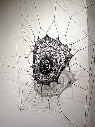 a hand made web that was installed in  a corner of the gallery